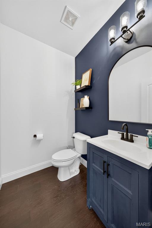 231 Flint Brook Dr, Ofallon, MO 63366 - bathroom featuring vanity and wood finished floors