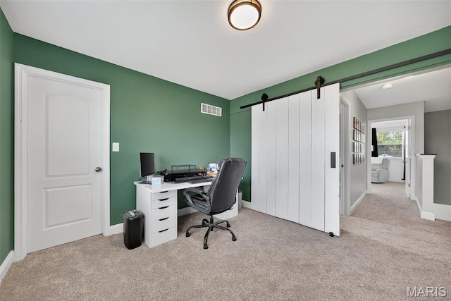 231 Flint Brook Dr, Ofallon, MO 63366 - carpeted office featuring a barn door and baseboards