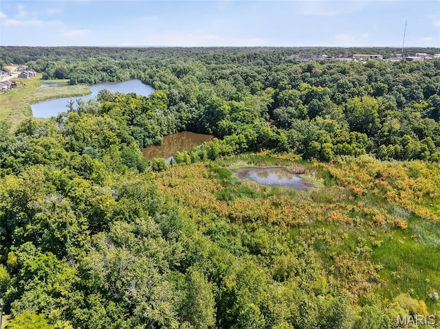 231 Flint Brook Dr, Ofallon, MO 63366 - drone / aerial view of a heavily wooded area and a nearby body of water