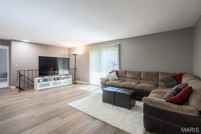 5593 Baronridge Dr Unit 7, Saint Louis, MO 63129 - living room featuring light wood-style floors and baseboards
