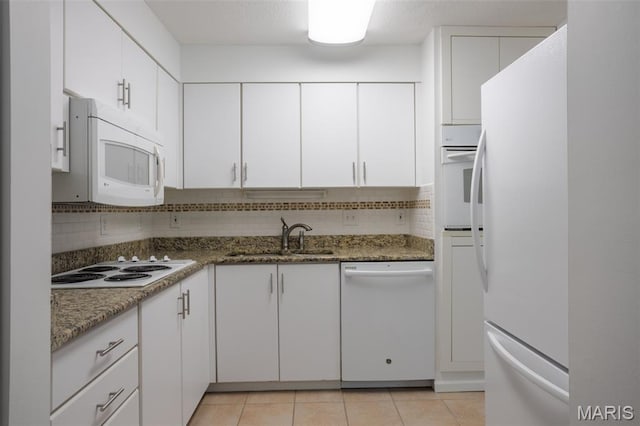 5593 Baronridge Dr Unit 7, Saint Louis, MO 63129 - kitchen with white appliances, tasteful backsplash, white cabinetry, and light tile patterned floors