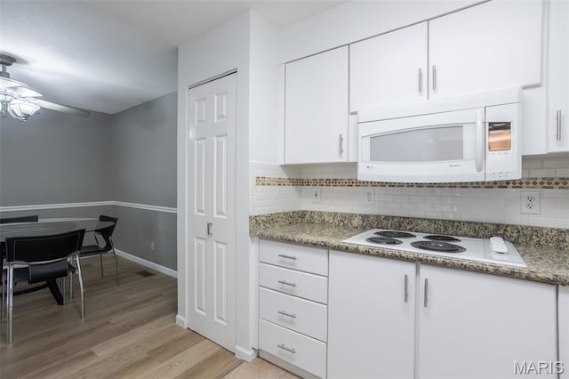 5593 Baronridge Dr Unit 7, Saint Louis, MO 63129 - kitchen featuring white appliances, white cabinetry, decorative backsplash, light wood-style floors, and ceiling fan