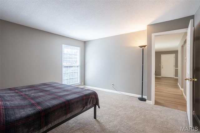 5593 Baronridge Dr Unit 7, Saint Louis, MO 63129 - carpeted bedroom with a textured ceiling