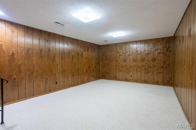 5593 Baronridge Dr Unit 7, Saint Louis, MO 63129 - finished below grade area with wood walls, a textured ceiling, and carpet floors