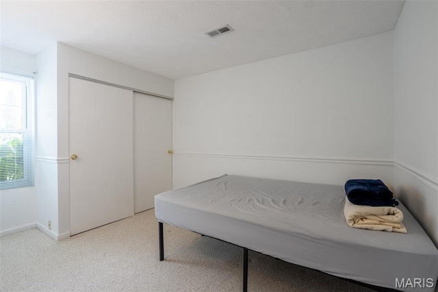 5593 Baronridge Dr Unit 7, Saint Louis, MO 63129 - bedroom with carpet flooring and a closet