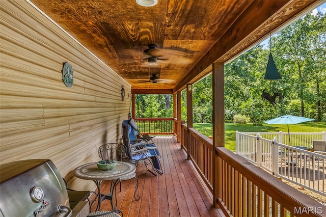 5090 Green Hills Rd, Festus, MO 63028 - deck featuring ceiling fan and a yard