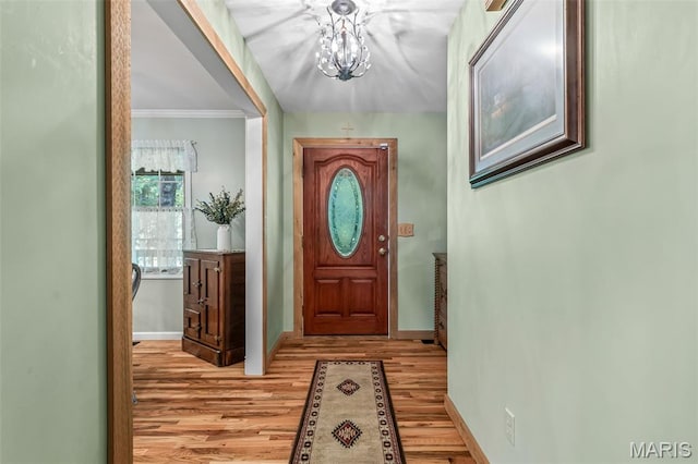 5090 Green Hills Rd, Festus, MO 63028 - entryway with light wood-type flooring, a chandelier, and ornamental molding