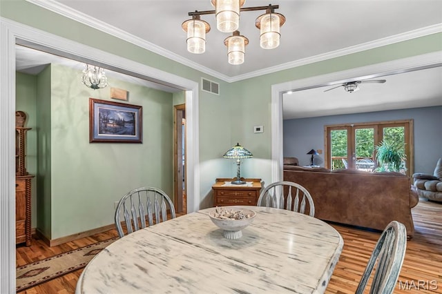 5090 Green Hills Rd, Festus, MO 63028 - dining room featuring a chandelier, wood finished floors, and ornamental molding