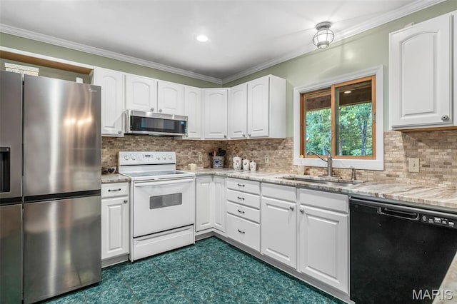 5090 Green Hills Rd, Festus, MO 63028 - kitchen featuring stainless steel appliances, white cabinets, dark flooring, light stone countertops, and ornamental molding