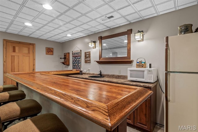 5090 Green Hills Rd, Festus, MO 63028 - indoor bar with white appliances and recessed lighting
