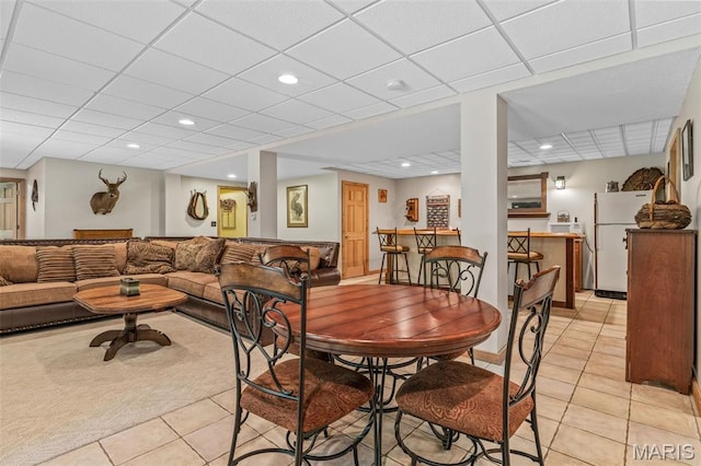 5090 Green Hills Rd, Festus, MO 63028 - dining area featuring light tile patterned floors, a dry bar, a drop ceiling, recessed lighting, and light carpet