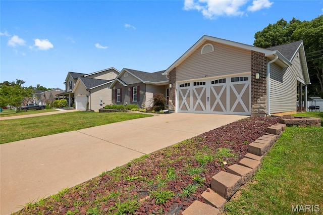 21 September St, Moscow Mills, MO 63362 - view of front of property with a garage, a front lawn, and driveway