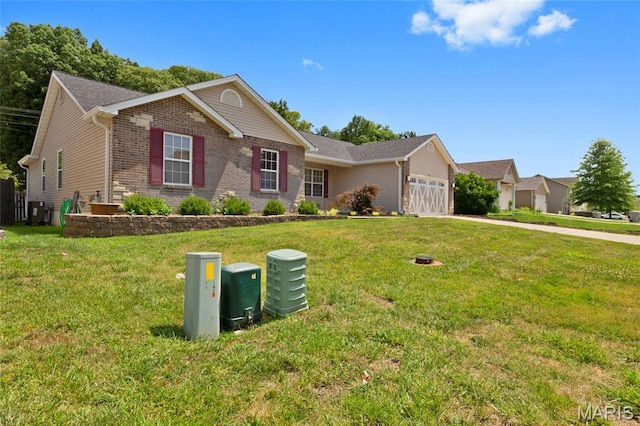 21 September St, Moscow Mills, MO 63362 - single story home featuring an attached garage, brick siding, a front yard, and driveway