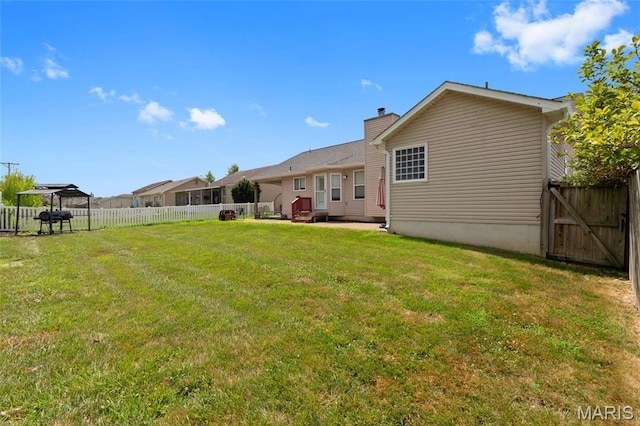 21 September St, Moscow Mills, MO 63362 - rear view of property featuring a gazebo, a fenced backyard, and a chimney
