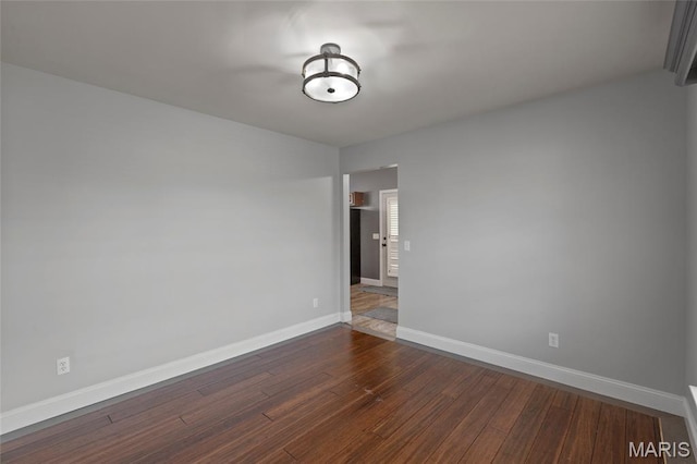 21 September St, Moscow Mills, MO 63362 - unfurnished room featuring dark wood-type flooring and baseboards
