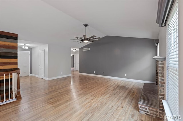 21 September St, Moscow Mills, MO 63362 - unfurnished living room featuring a ceiling fan, light wood-type flooring, and vaulted ceiling