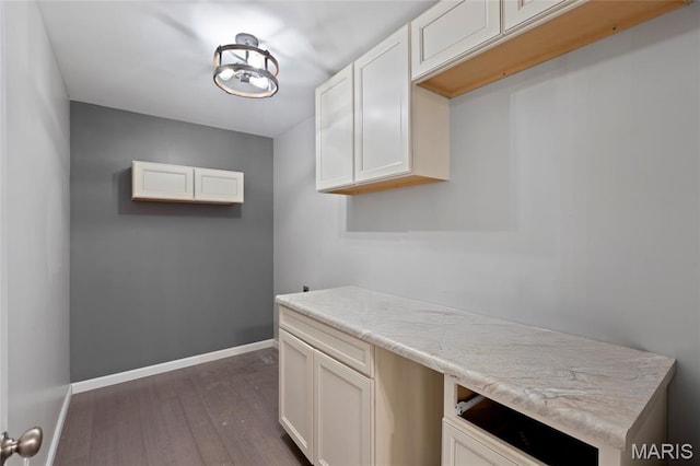 21 September St, Moscow Mills, MO 63362 - laundry room featuring dark wood finished floors and baseboards