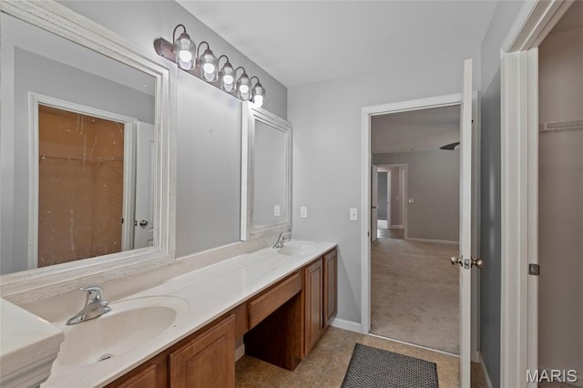 21 September St, Moscow Mills, MO 63362 - full bathroom featuring double vanity, a walk in closet, and tile patterned flooring