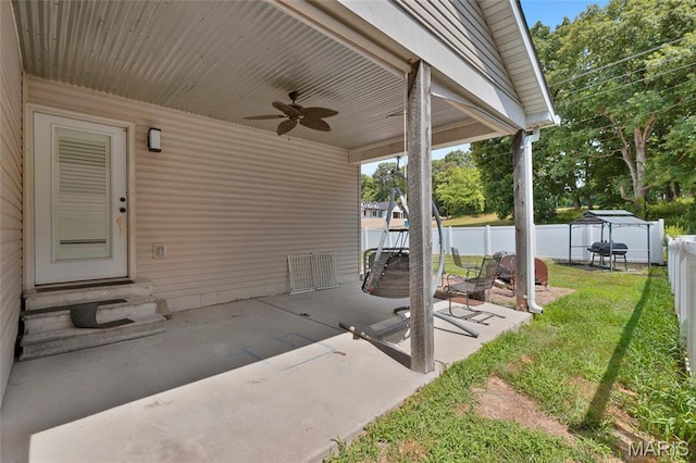 21 September St, Moscow Mills, MO 63362 - fenced backyard with entry steps, a ceiling fan, and a patio
