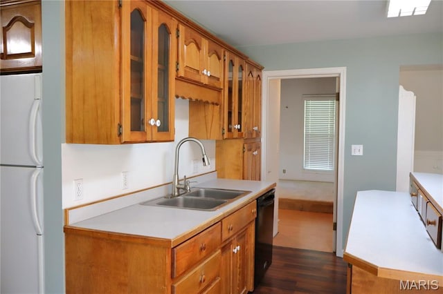 616 Greensferry Rd, Jackson, MO 63755 - kitchen with freestanding refrigerator, black dishwasher, light countertops, and dark wood-style flooring