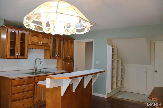 616 Greensferry Rd, Jackson, MO 63755 - kitchen with brown cabinets, light countertops, glass insert cabinets, and wood finished floors