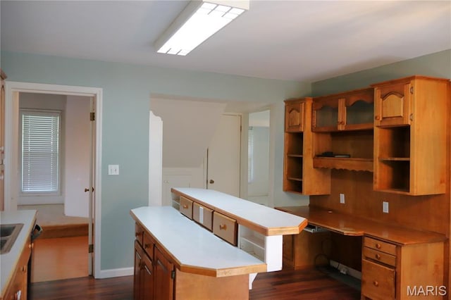 616 Greensferry Rd, Jackson, MO 63755 - kitchen with a kitchen island, open shelves, dark wood-style flooring, light countertops, and brown cabinets