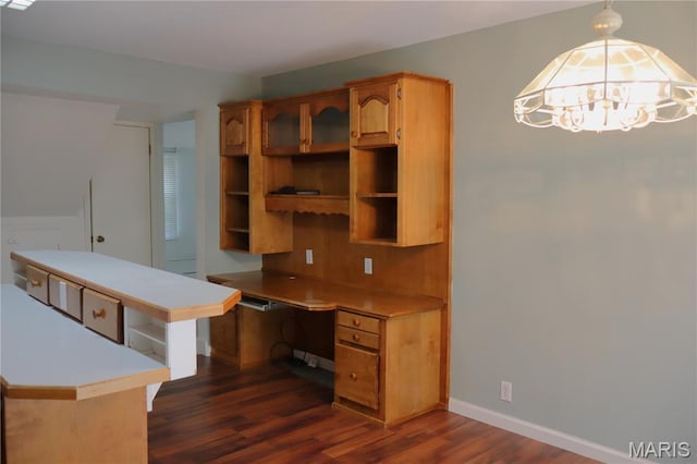 616 Greensferry Rd, Jackson, MO 63755 - kitchen with built in desk, open shelves, dark wood-style floors, light countertops, and a chandelier