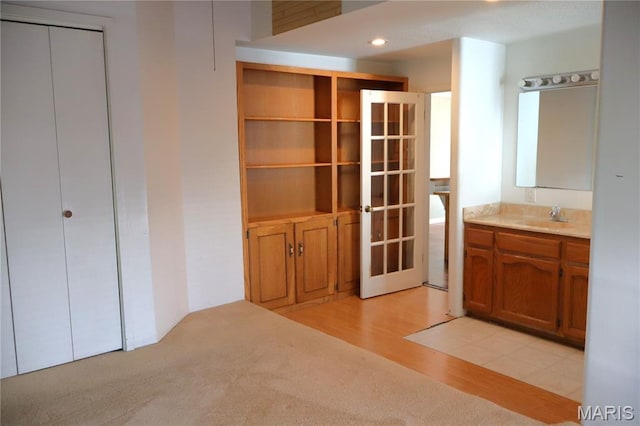 616 Greensferry Rd, Jackson, MO 63755 - bathroom featuring french doors, vanity, and wood finished floors