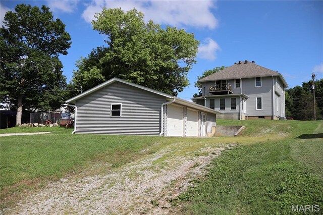 616 Greensferry Rd, Jackson, MO 63755 - rear view of house featuring a garage and a yard