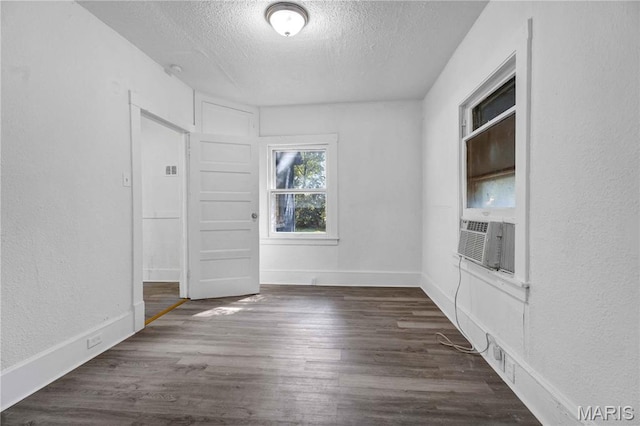 5316 Janet Ave, Jennings, MO 63136 - unfurnished room with a textured ceiling, wood finished floors, cooling unit, and a textured wall