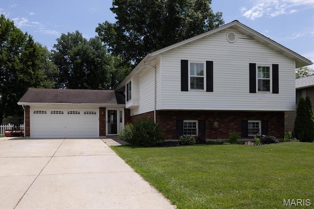 1715 Foxglove Dr, Saint Charles, MO 63303 - split level home featuring brick siding, driveway, a garage, and a front yard