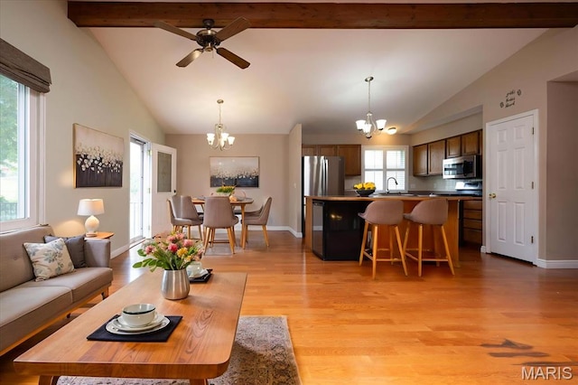 1715 Foxglove Dr, Saint Charles, MO 63303 - living area with a chandelier, light wood-style flooring, and a ceiling fan