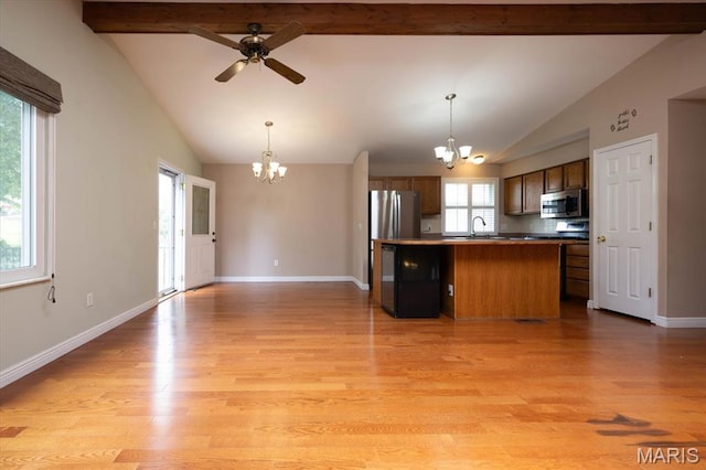 1715 Foxglove Dr, Saint Charles, MO 63303 - kitchen featuring a chandelier, appliances with stainless steel finishes, light wood-style flooring, and open floor plan