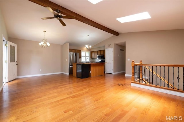 1715 Foxglove Dr, Saint Charles, MO 63303 - unfurnished living room with a chandelier, light wood-style floors, and a ceiling fan
