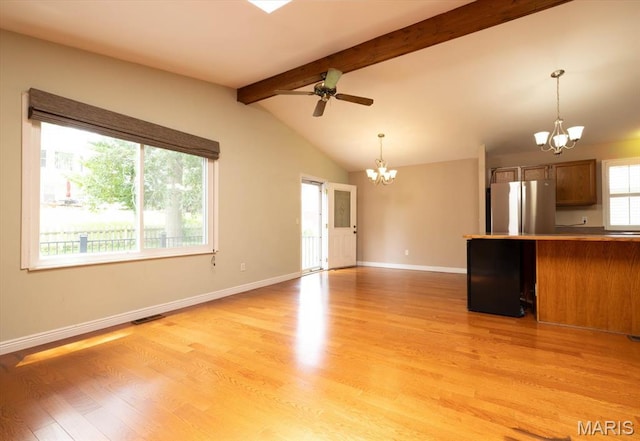 1715 Foxglove Dr, Saint Charles, MO 63303 - unfurnished living room featuring a chandelier, light wood-style floors, and ceiling fan