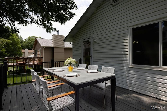 1715 Foxglove Dr, Saint Charles, MO 63303 - wooden deck featuring outdoor dining area