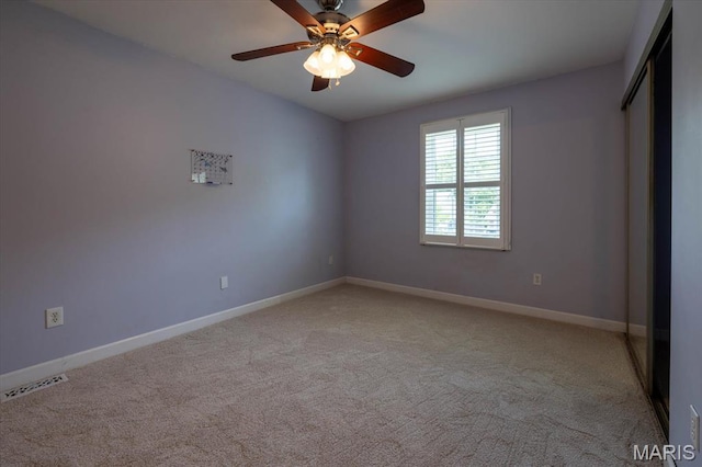 1715 Foxglove Dr, Saint Charles, MO 63303 - unfurnished bedroom with light colored carpet, a ceiling fan, and a closet
