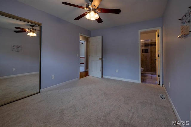 1715 Foxglove Dr, Saint Charles, MO 63303 - unfurnished bedroom with carpet floors, ceiling fan, a closet, and connected bathroom