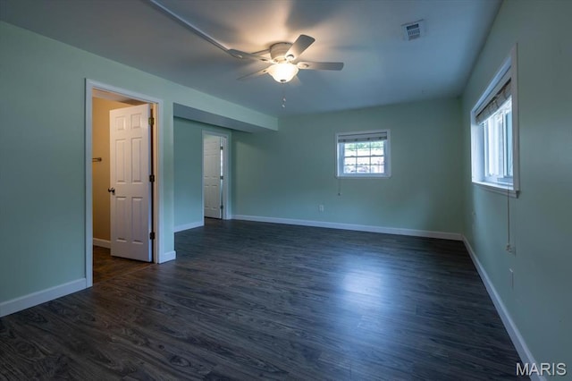 1715 Foxglove Dr, Saint Charles, MO 63303 - empty room with a ceiling fan and dark wood-style flooring