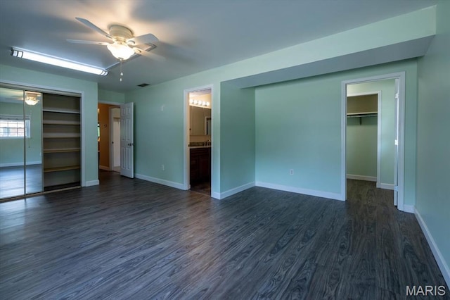 1715 Foxglove Dr, Saint Charles, MO 63303 - unfurnished bedroom with dark wood-type flooring, a walk in closet, ceiling fan, and ensuite bath
