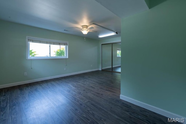 1715 Foxglove Dr, Saint Charles, MO 63303 - spare room featuring a ceiling fan and dark wood-type flooring