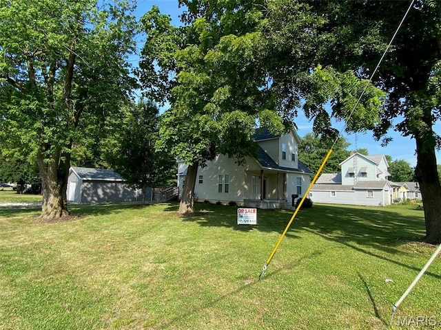 201 N Vine St, Nokomis, IL 62075 - view of green lawn featuring an outbuilding