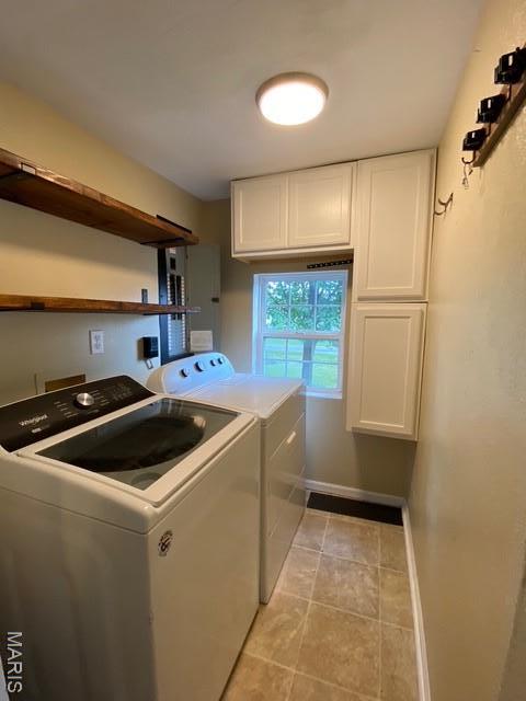 201 N Vine St, Nokomis, IL 62075 - laundry room featuring cabinet space, washing machine and dryer, and light tile patterned flooring