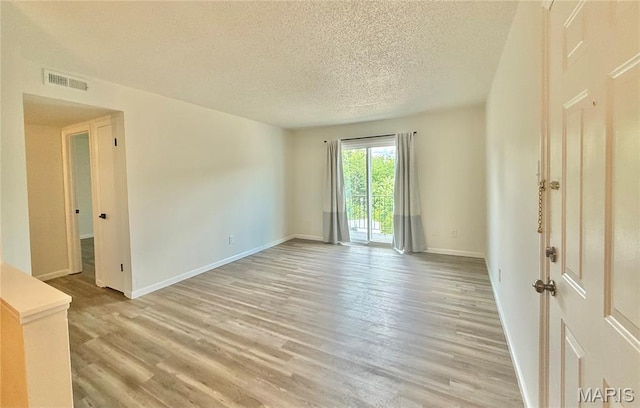 601 N Monroe St Unit 9, Pacific, MO 63069 - empty room featuring a textured ceiling and light wood-style floors