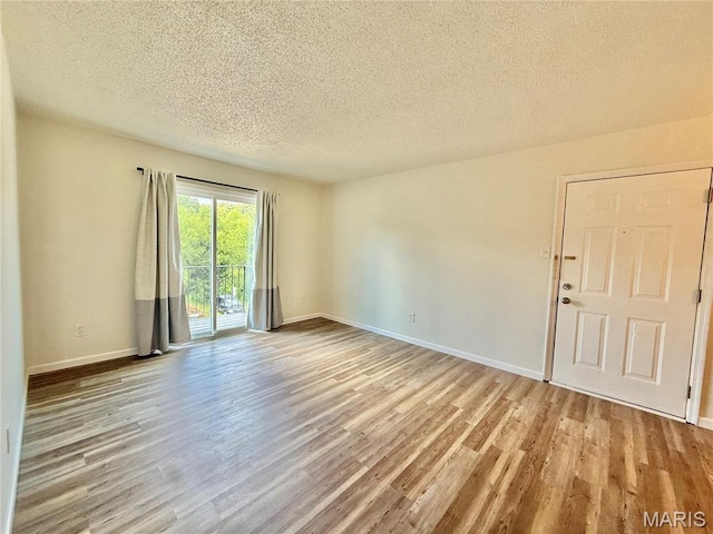 601 N Monroe St Unit 9, Pacific, MO 63069 - unfurnished room with wood finished floors and a textured ceiling