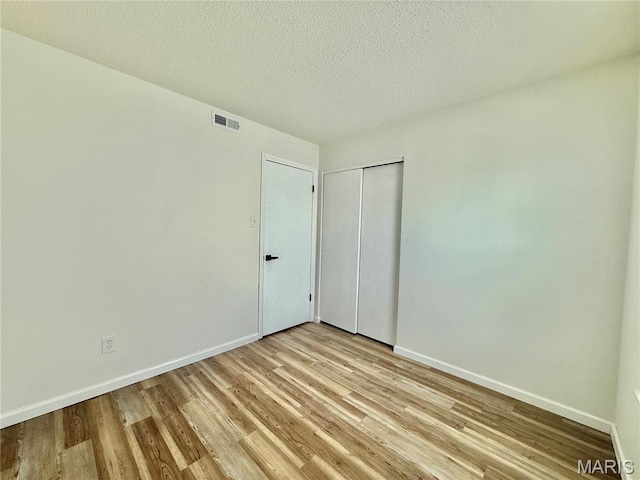 601 N Monroe St Unit 9, Pacific, MO 63069 - unfurnished room featuring light wood finished floors and a textured ceiling