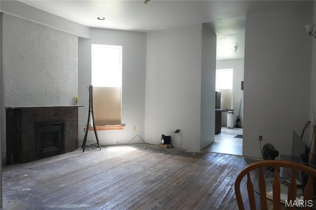 3632 Cook Ave, Saint Louis, MO 63113 - unfurnished living room with wood-type flooring and a fireplace