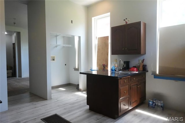 3632 Cook Ave, Saint Louis, MO 63113 - kitchen with light wood finished floors and dark countertops
