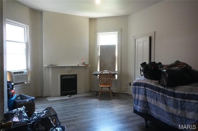3632 Cook Ave, Saint Louis, MO 63113 - living room featuring a fireplace, wood finished floors, and cooling unit