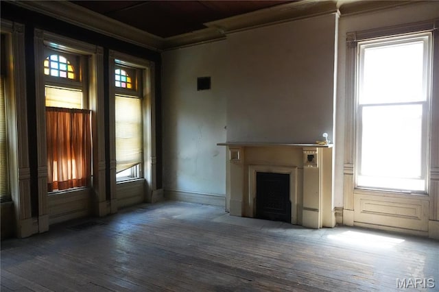 3632 Cook Ave, Saint Louis, MO 63113 - unfurnished living room featuring hardwood / wood-style floors, a fireplace with flush hearth, plenty of natural light, and ornamental molding